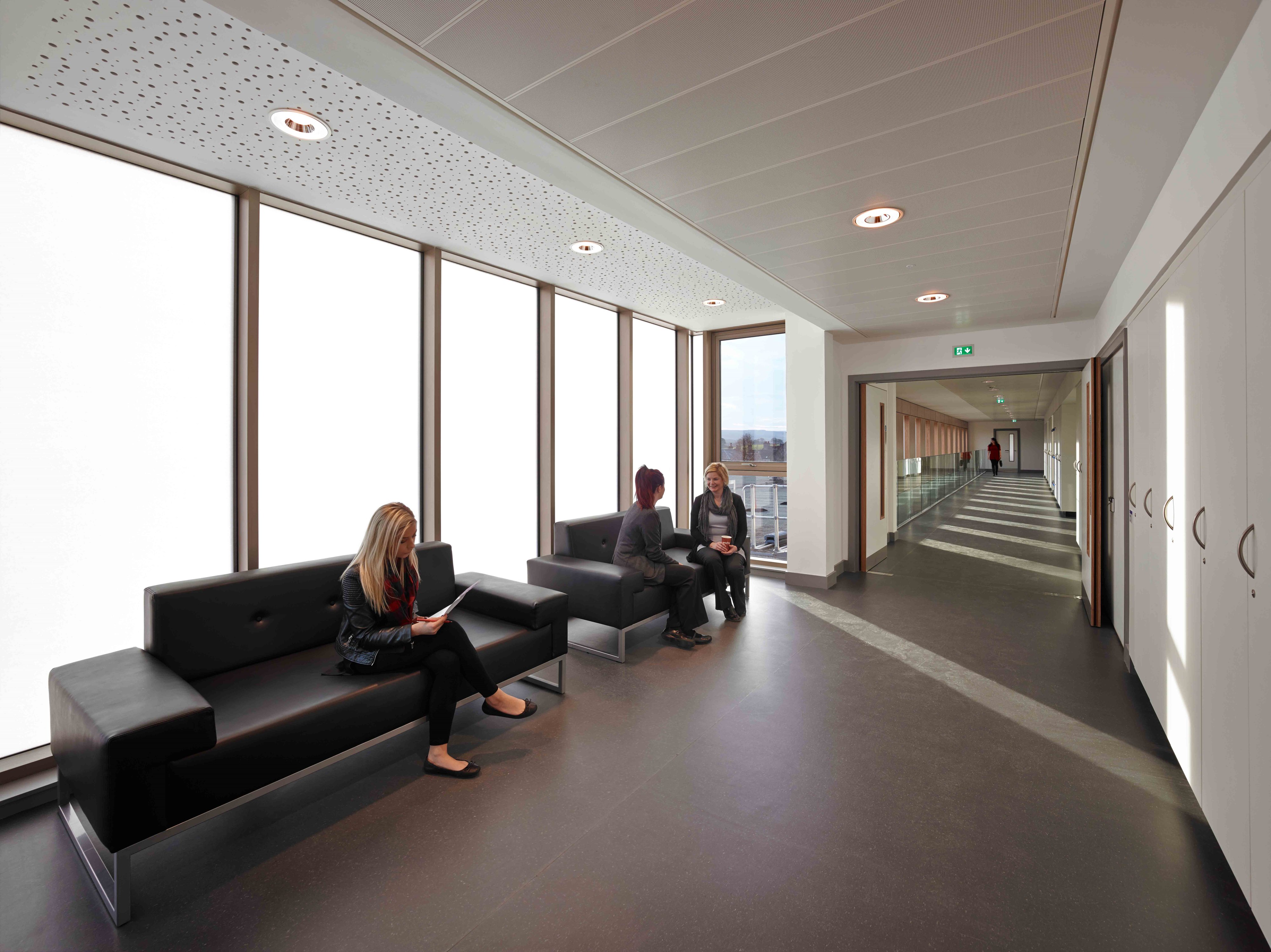 OKALUX Plus lounge interior — luminous capillary wall and corner view