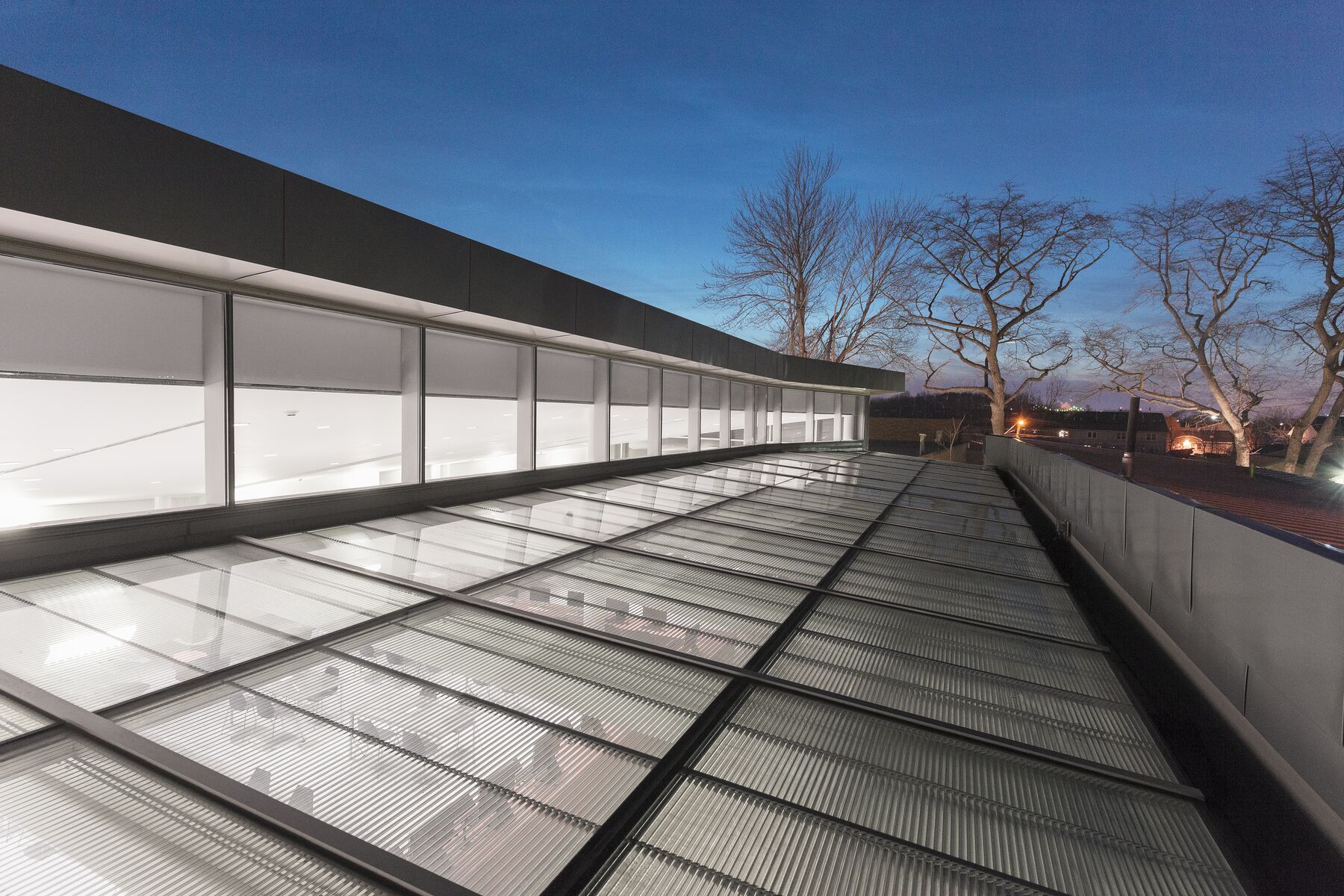 OKASOLAR S sun protection grid on the rooftop skylight of Mariners Library, Staten Island, New York at dusk